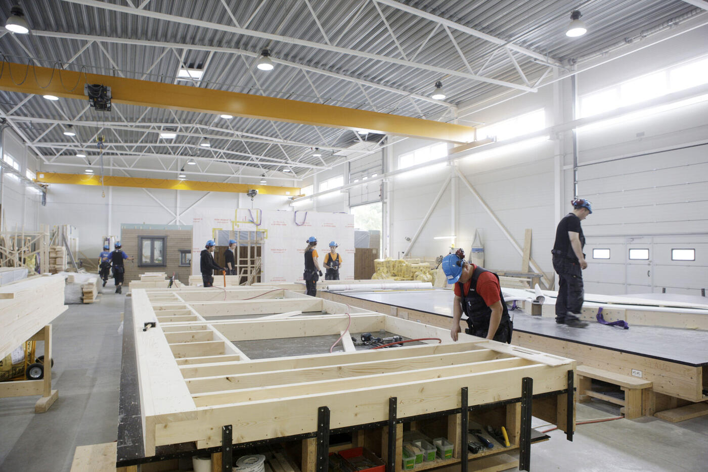 Wall elements being assembled on production tables in the factory